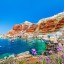 Waar en wanneer kunt u zwemmen op Santorini: zeetemperatuur van maand tot maand