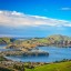 Wanneer kunt u gaan zwemmen in Dunedin: zeetemperatuur maand per maand